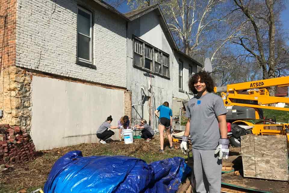 Student volunteers working on a housing jobsite