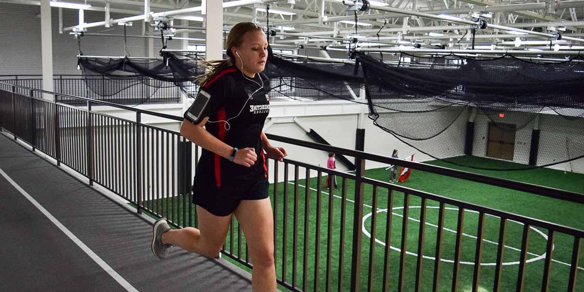 A student runs on a track in the Murphy Recreation Center
